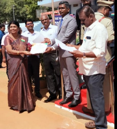 Best NGO award received by Jansi from the District collector Mr.Sridhar I.A.S